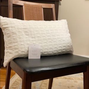 White decorative pillow with insert.